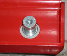 Locking pin fitted to the floor, with the plate sitting over it